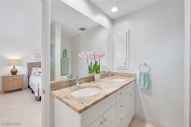 bathroom featuring tile patterned floors and vanity