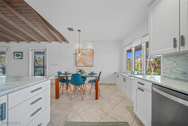 kitchen featuring pendant lighting, stainless steel dishwasher, white cabinets, and light stone counters