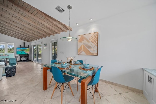 dining space with light tile patterned floors, lofted ceiling with beams, and wood ceiling