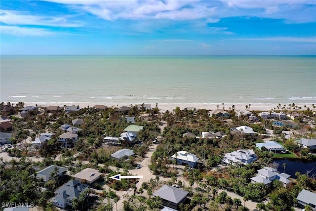 aerial view featuring a water view and a view of the beach