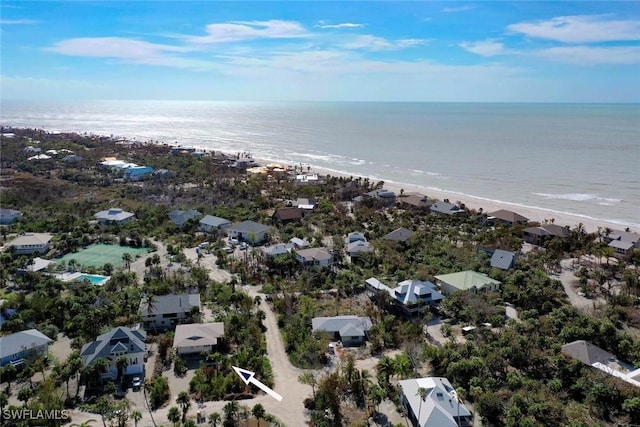 bird's eye view featuring a water view and a view of the beach