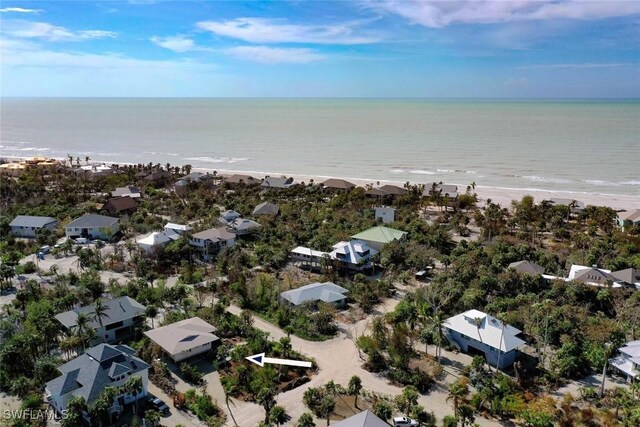 bird's eye view with a view of the beach and a water view