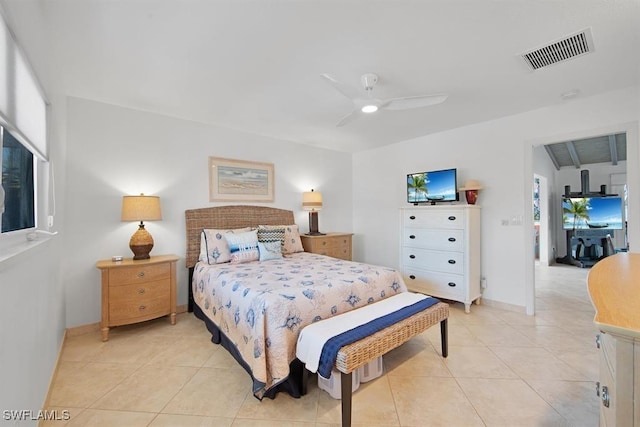 tiled bedroom with ceiling fan and multiple windows