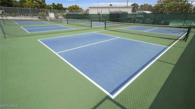 view of sport court with basketball hoop