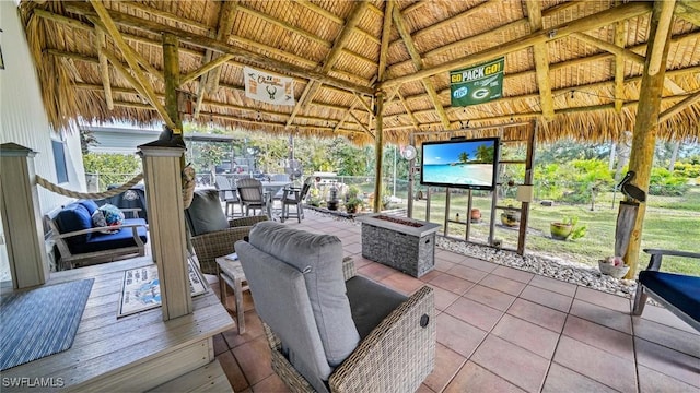 view of patio featuring a fire pit and a gazebo