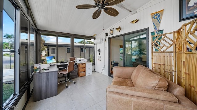 tiled office with lofted ceiling and ceiling fan