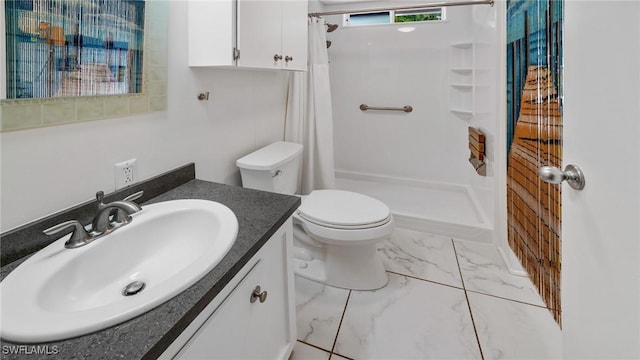 bathroom with vanity, curtained shower, and toilet