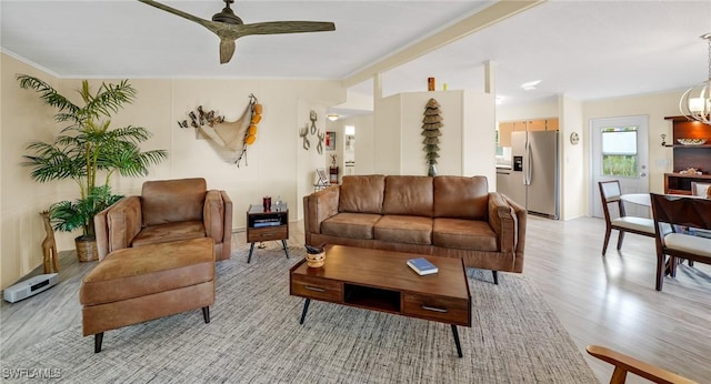 living room featuring ceiling fan and light wood-type flooring