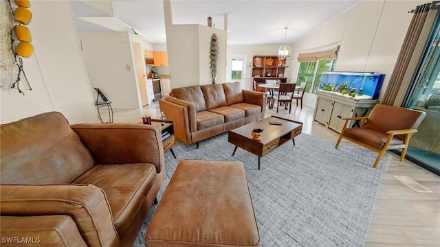 living room featuring an inviting chandelier