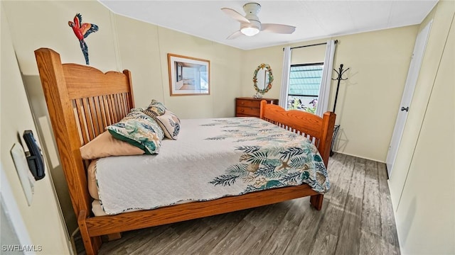 bedroom with hardwood / wood-style floors and ceiling fan