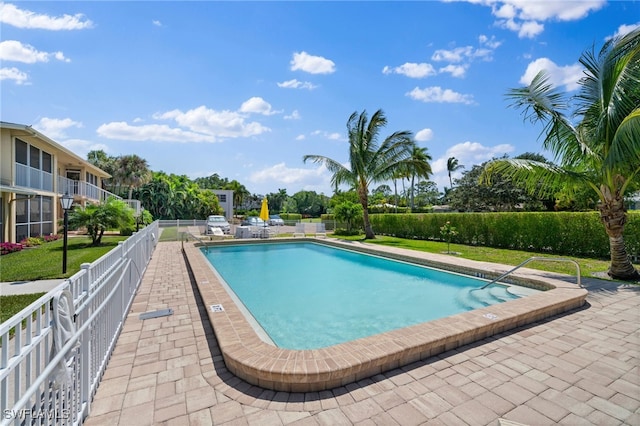 view of swimming pool featuring a patio area