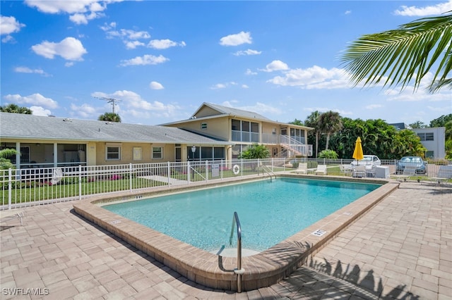 view of swimming pool with a patio area