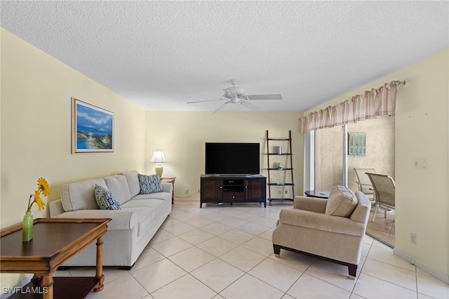 tiled living room featuring a textured ceiling and ceiling fan