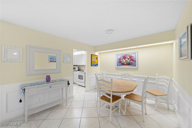 dining area featuring light tile patterned floors