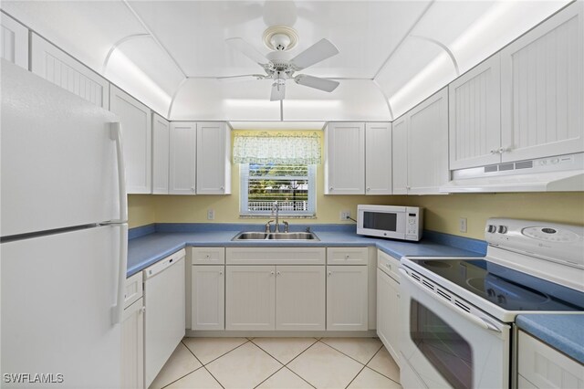 kitchen with light tile patterned flooring, sink, ceiling fan, white appliances, and white cabinets