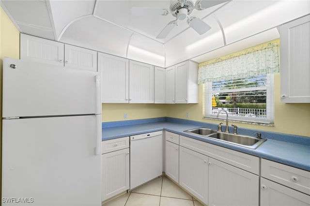 kitchen with white cabinetry, white appliances, sink, and light tile patterned floors