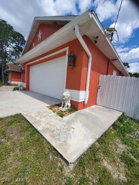 view of side of home with a garage