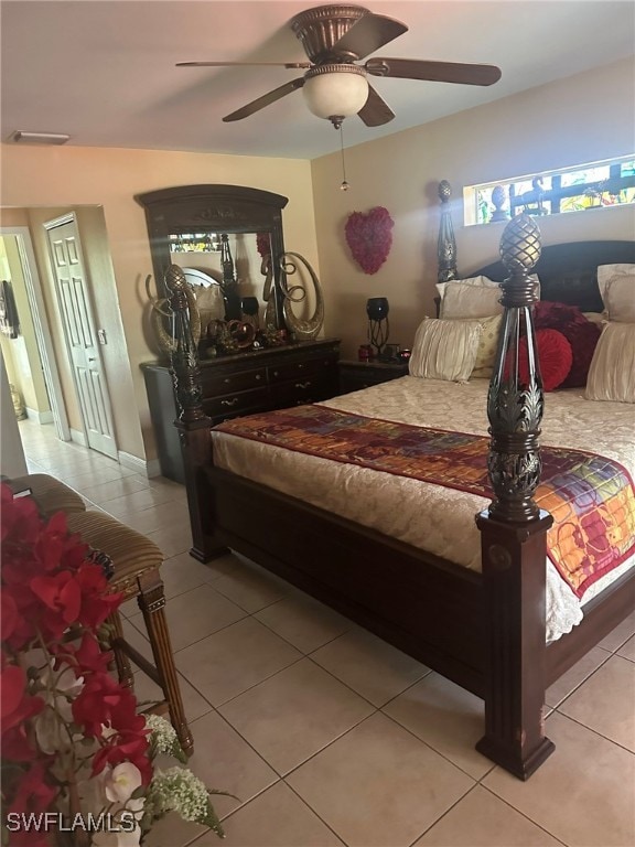 bedroom with light tile patterned floors and ceiling fan