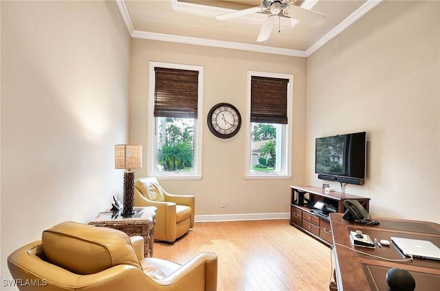 sitting room with ceiling fan, ornamental molding, and light wood-type flooring