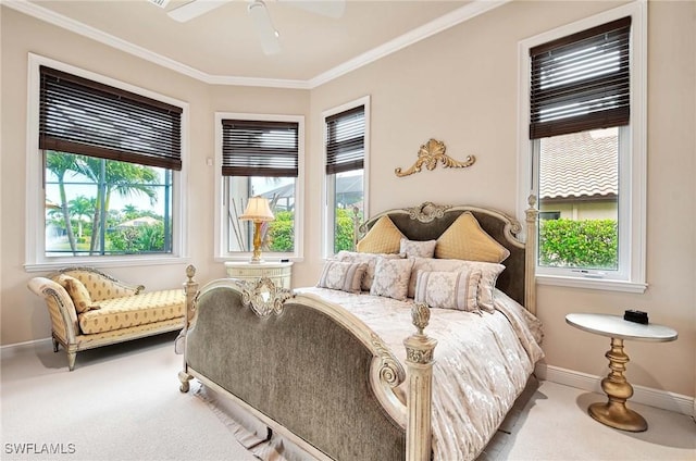 carpeted bedroom with ceiling fan and ornamental molding