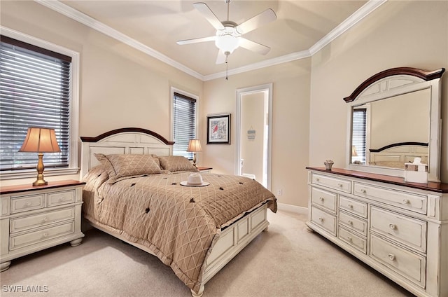 bedroom featuring multiple windows, ceiling fan, crown molding, and light colored carpet