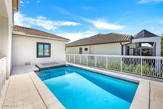 view of swimming pool featuring a patio area