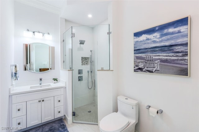 bathroom with tile patterned floors, toilet, vanity, crown molding, and a shower with shower door