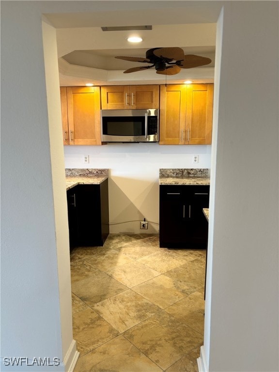 kitchen featuring ceiling fan