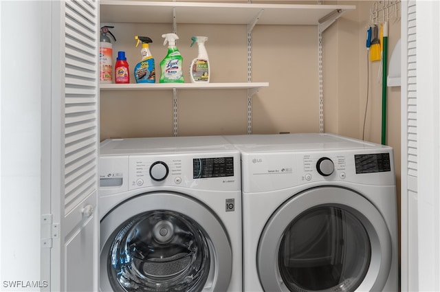 washroom with independent washer and dryer