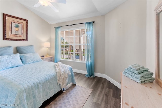 bedroom with lofted ceiling, hardwood / wood-style flooring, and ceiling fan