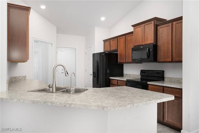 kitchen with sink, kitchen peninsula, vaulted ceiling, light tile patterned flooring, and black appliances