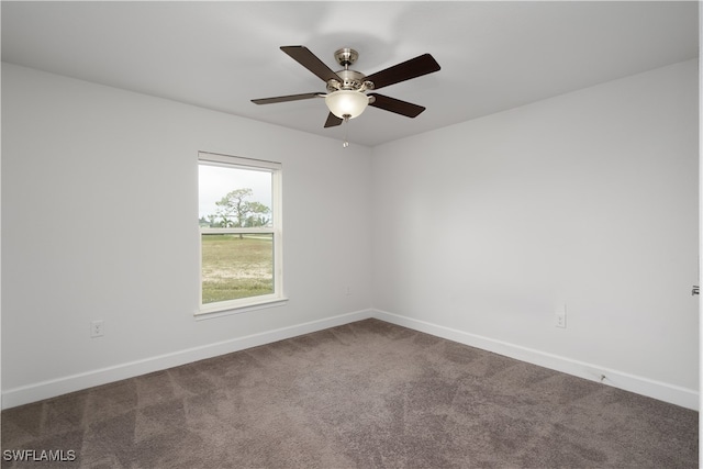 empty room with carpet flooring and ceiling fan