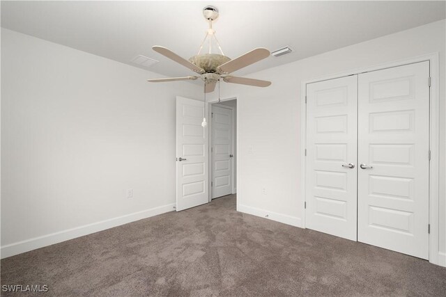 unfurnished bedroom featuring carpet flooring, a closet, and ceiling fan