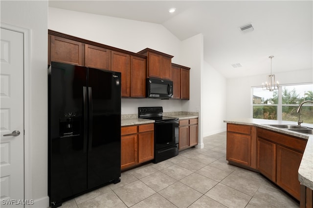 kitchen featuring black appliances, sink, decorative light fixtures, vaulted ceiling, and a notable chandelier