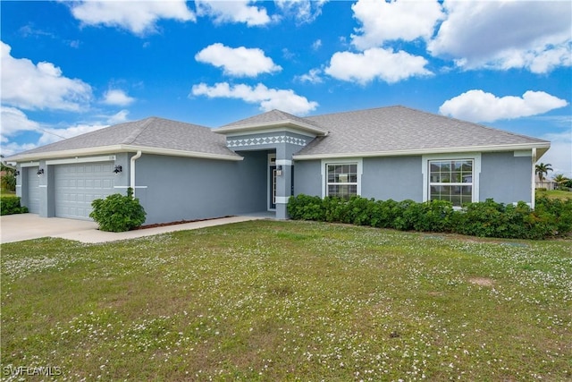 view of front of property with a garage and a front yard