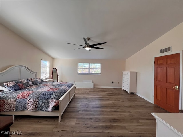 bedroom with dark wood-type flooring, ceiling fan, and lofted ceiling