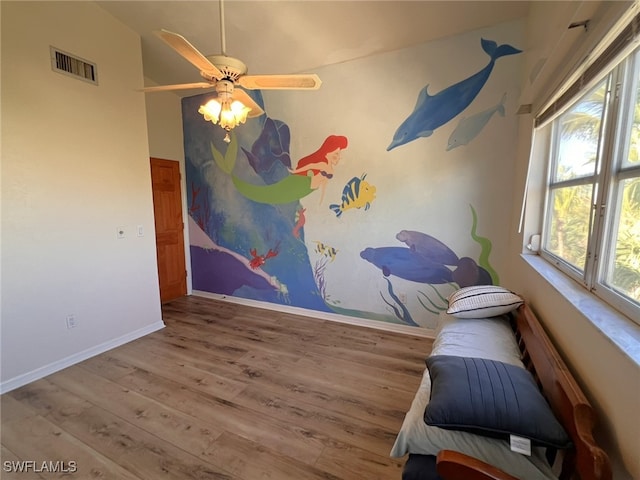 interior space featuring hardwood / wood-style floors and ceiling fan