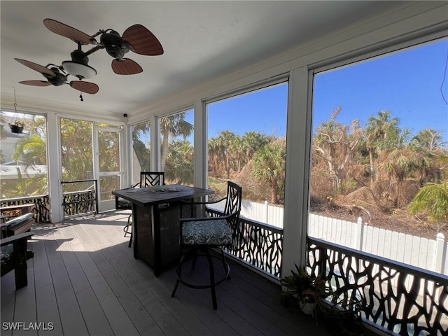 sunroom / solarium with ceiling fan