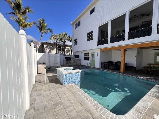 view of pool featuring a patio area and a jacuzzi