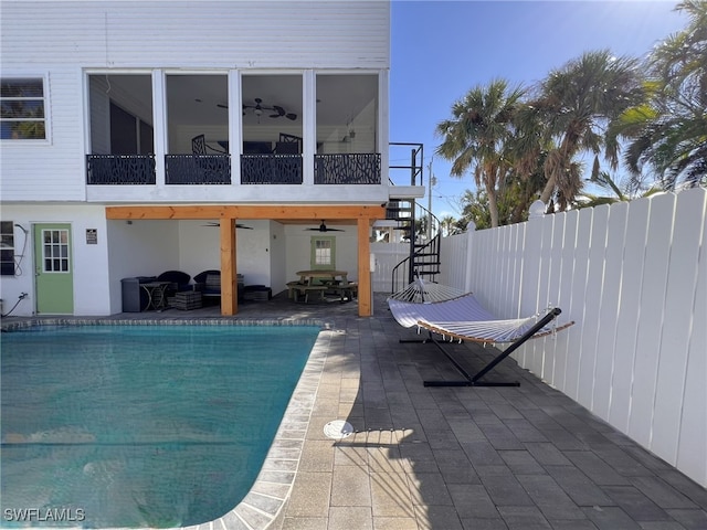 exterior space with ceiling fan and a patio