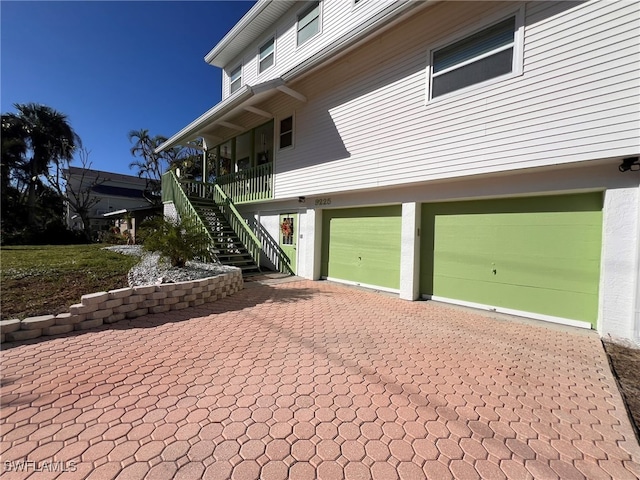 view of side of home with a garage