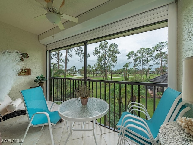 sunroom / solarium featuring ceiling fan and plenty of natural light