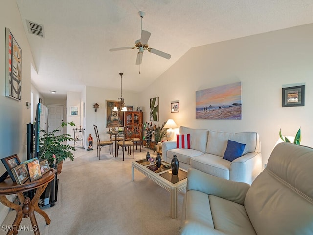 living room with light carpet, ceiling fan, and lofted ceiling