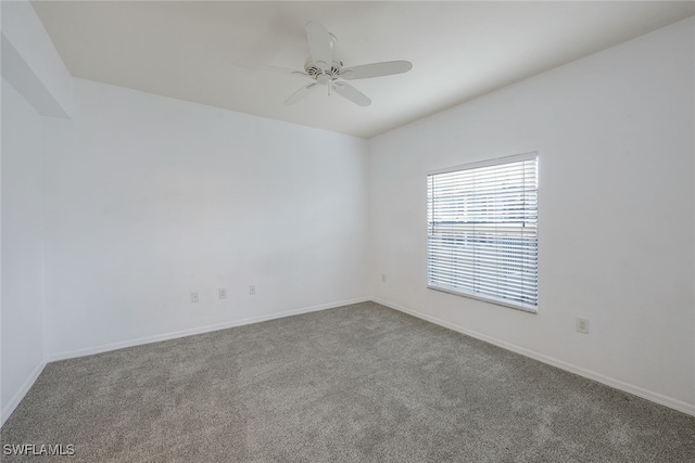 unfurnished room with ceiling fan and carpet floors