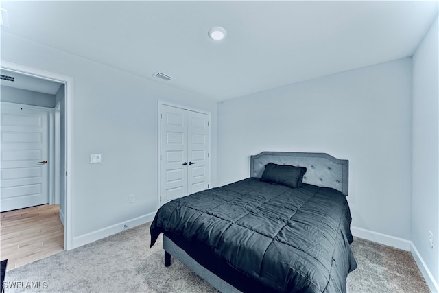 bedroom featuring a closet and wood-type flooring