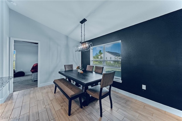 3002 40th St W, Lehigh Acres, FL 33971 - dining area featuring wood tiled floors, lofted ceiling, and baseboards