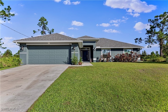 view of front of property featuring a garage and a front yard