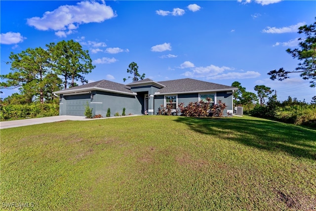 view of front of home with a garage and a front yard