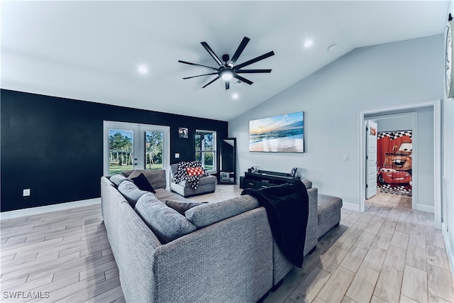 living room with french doors, light hardwood / wood-style flooring, lofted ceiling, and ceiling fan