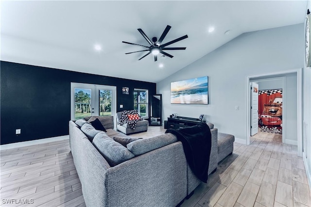 3002 40th St W, Lehigh Acres, FL 33971 - living room featuring a ceiling fan, wood finish floors, vaulted ceiling, recessed lighting, and french doors